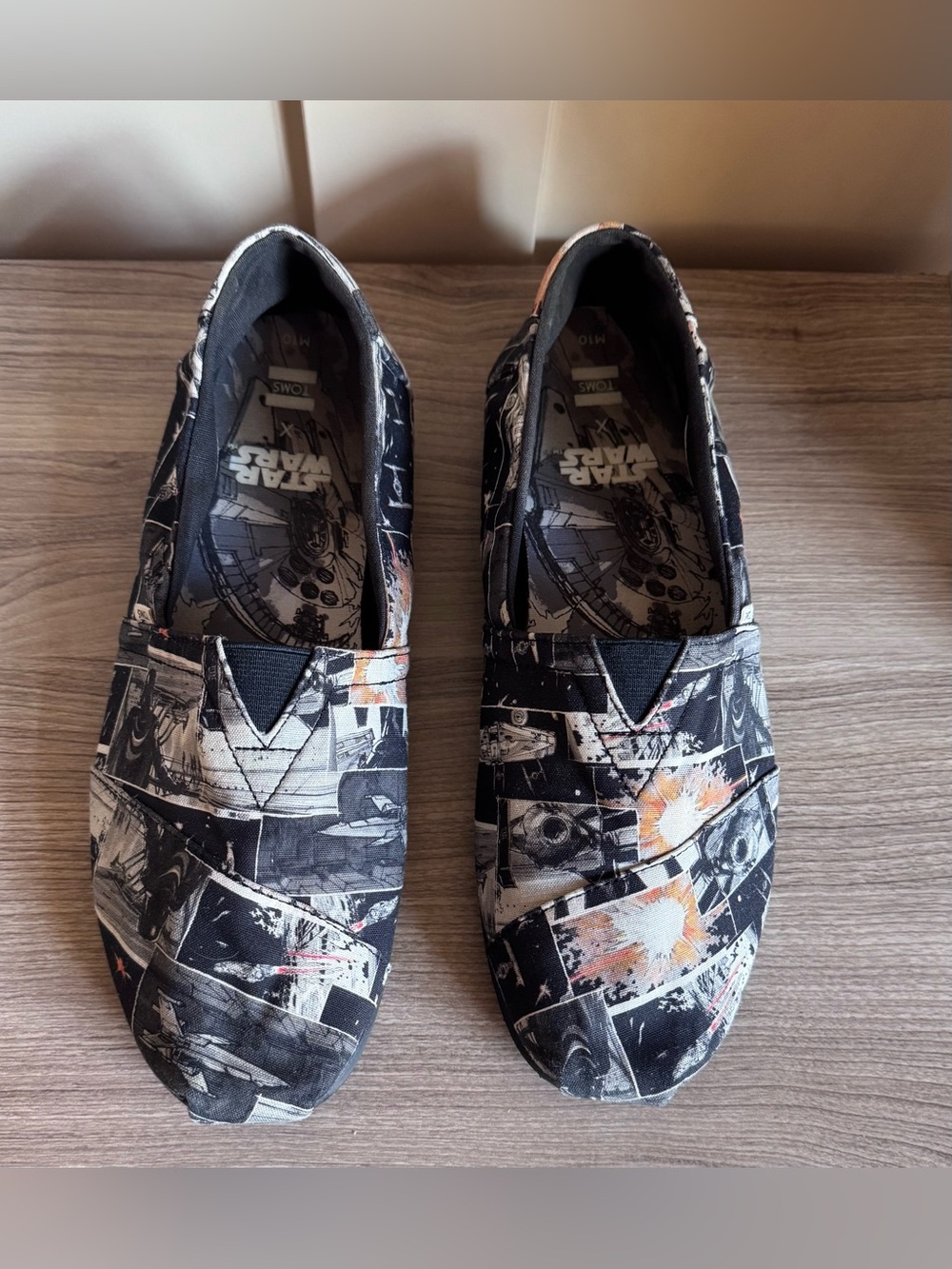 Toms Men’s Black and Orange Star Wars Graphic Slip-On Loafers